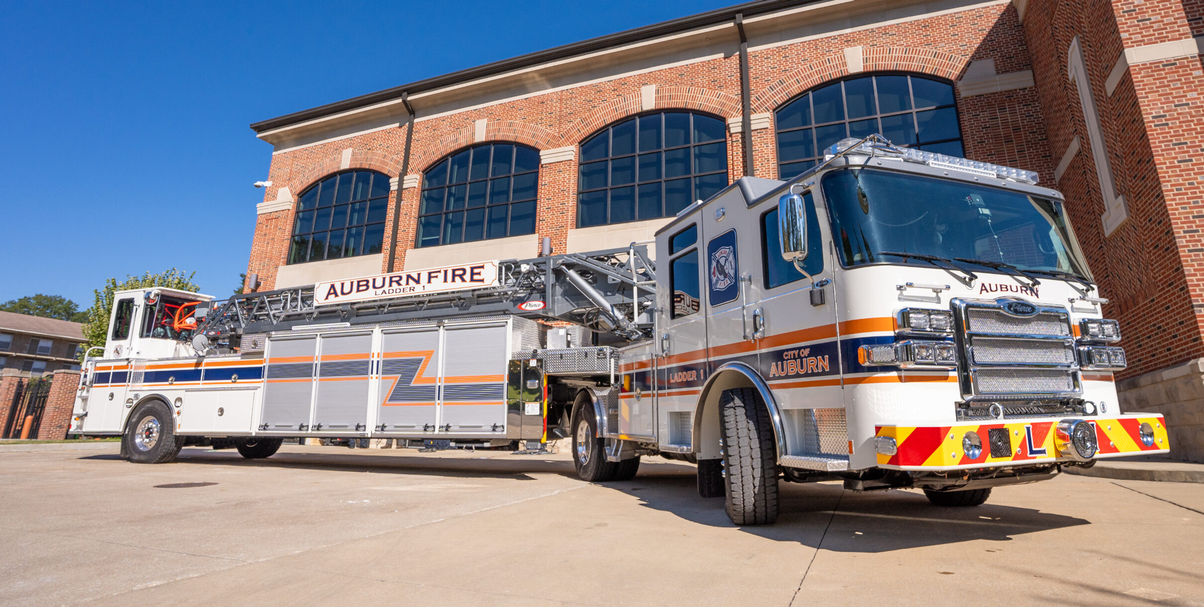 Tiller truck in front of Station 1