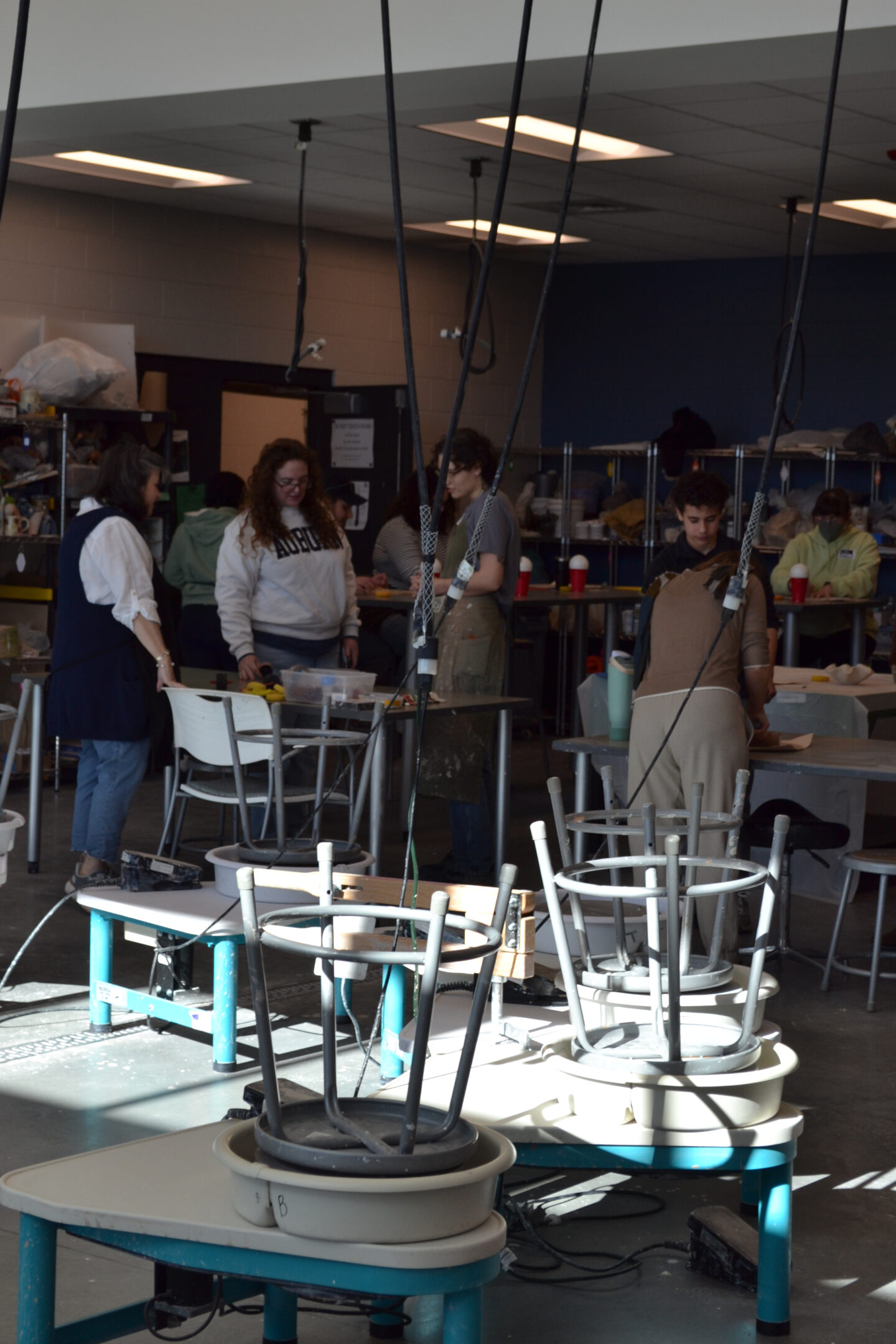Image shows adults in our adult workshop building their wavy bowls