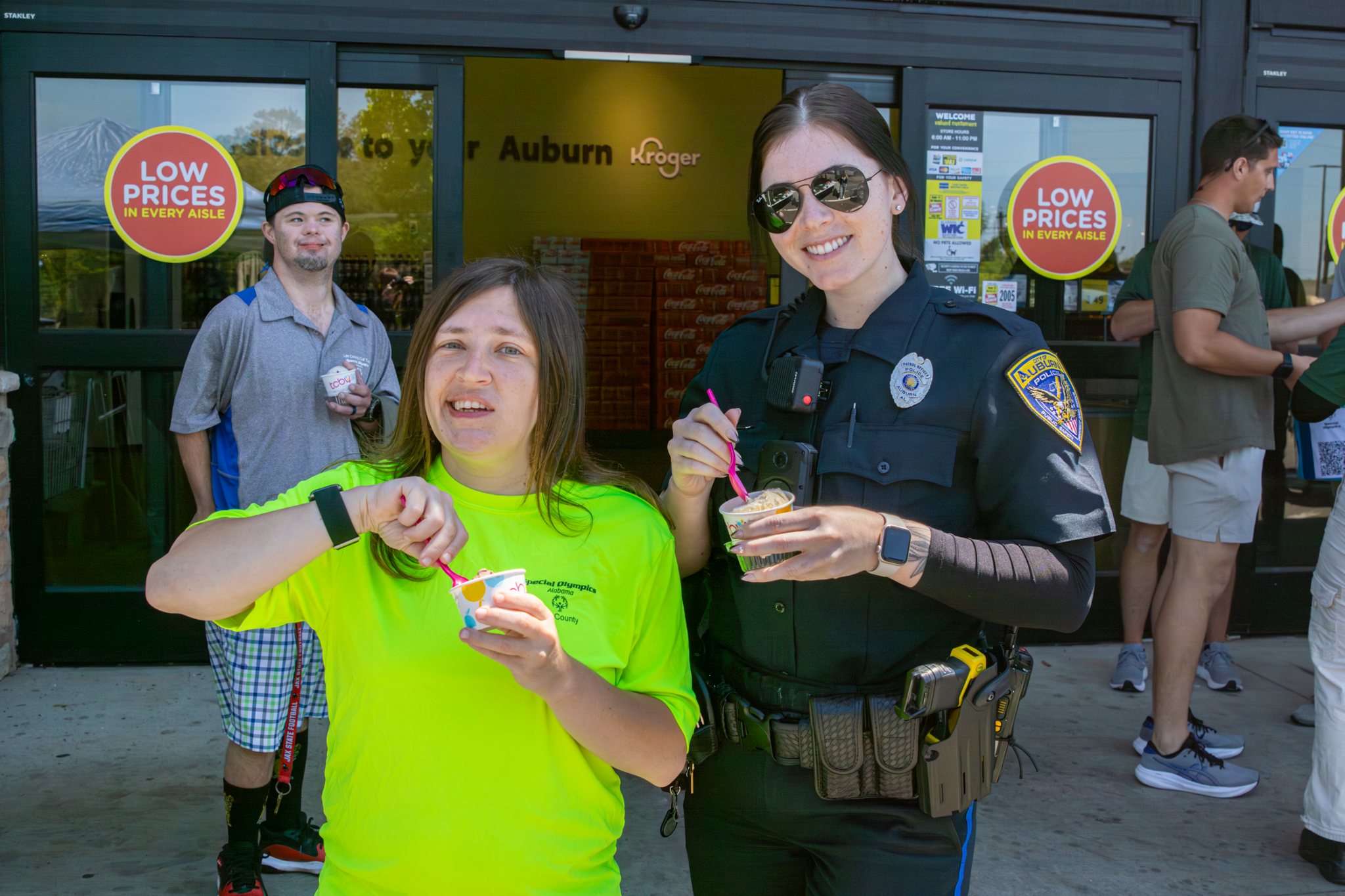 Officer eating ice cream with citizen