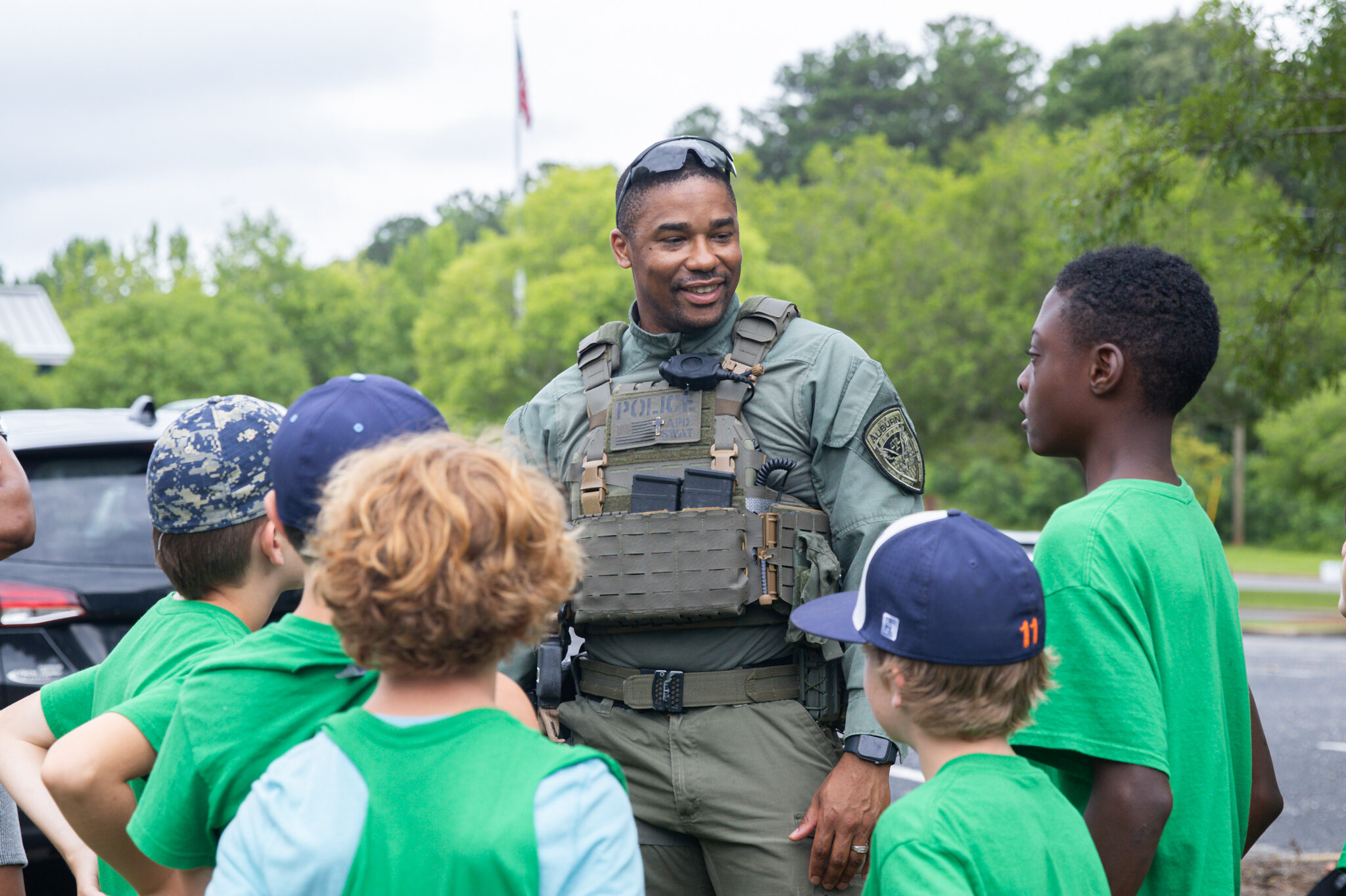 SWAT team member talking to children at DARE camp