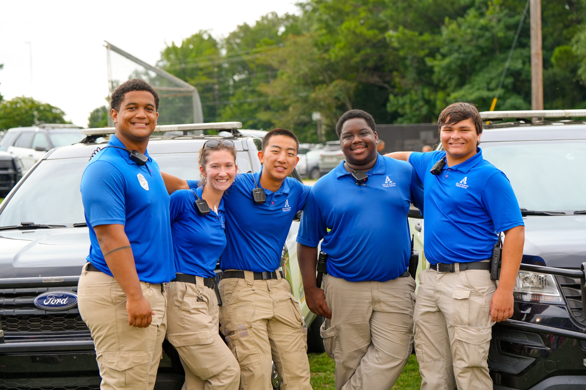Public Safety Officers posing with arms around each other